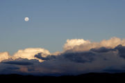 Moon over cumulus clouds